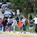 Students walk with their parents as they make their way to  Logan Elementary School on the first day of school on Tuesday, September 3, 2013. Melanie Maxwell | AnnArbor.com